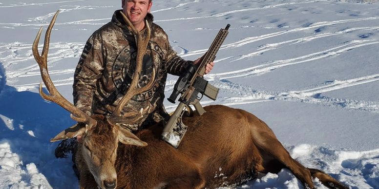 Hunter with his first stag